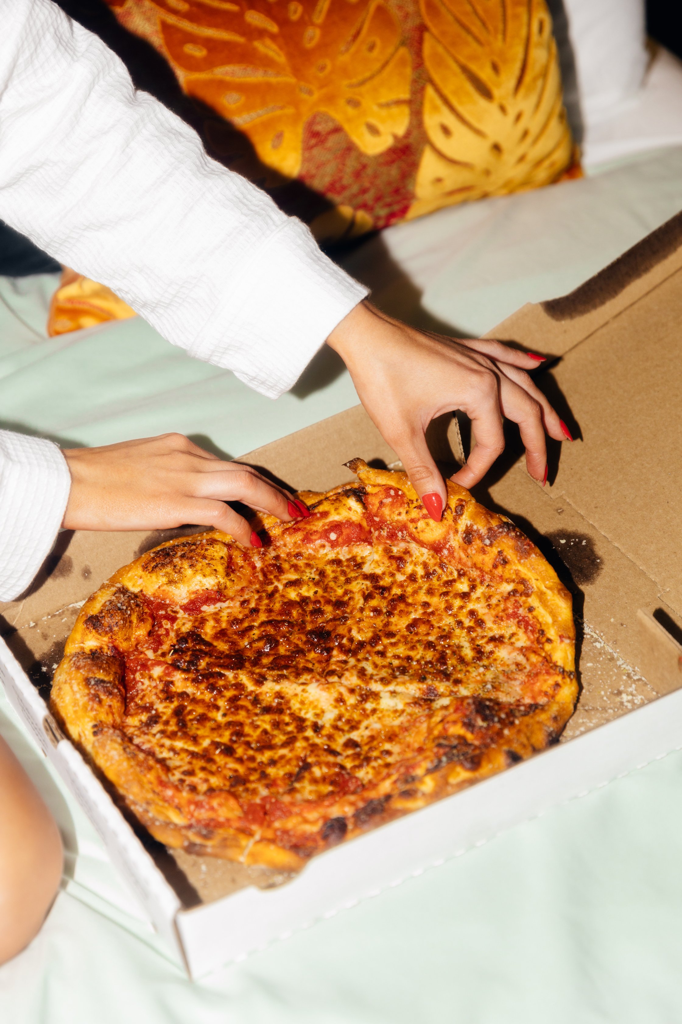 Hotel Influencer Taking a Slice of Pizza 